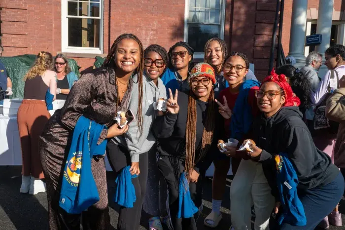 Students smile in a group on Mountain Day 2023